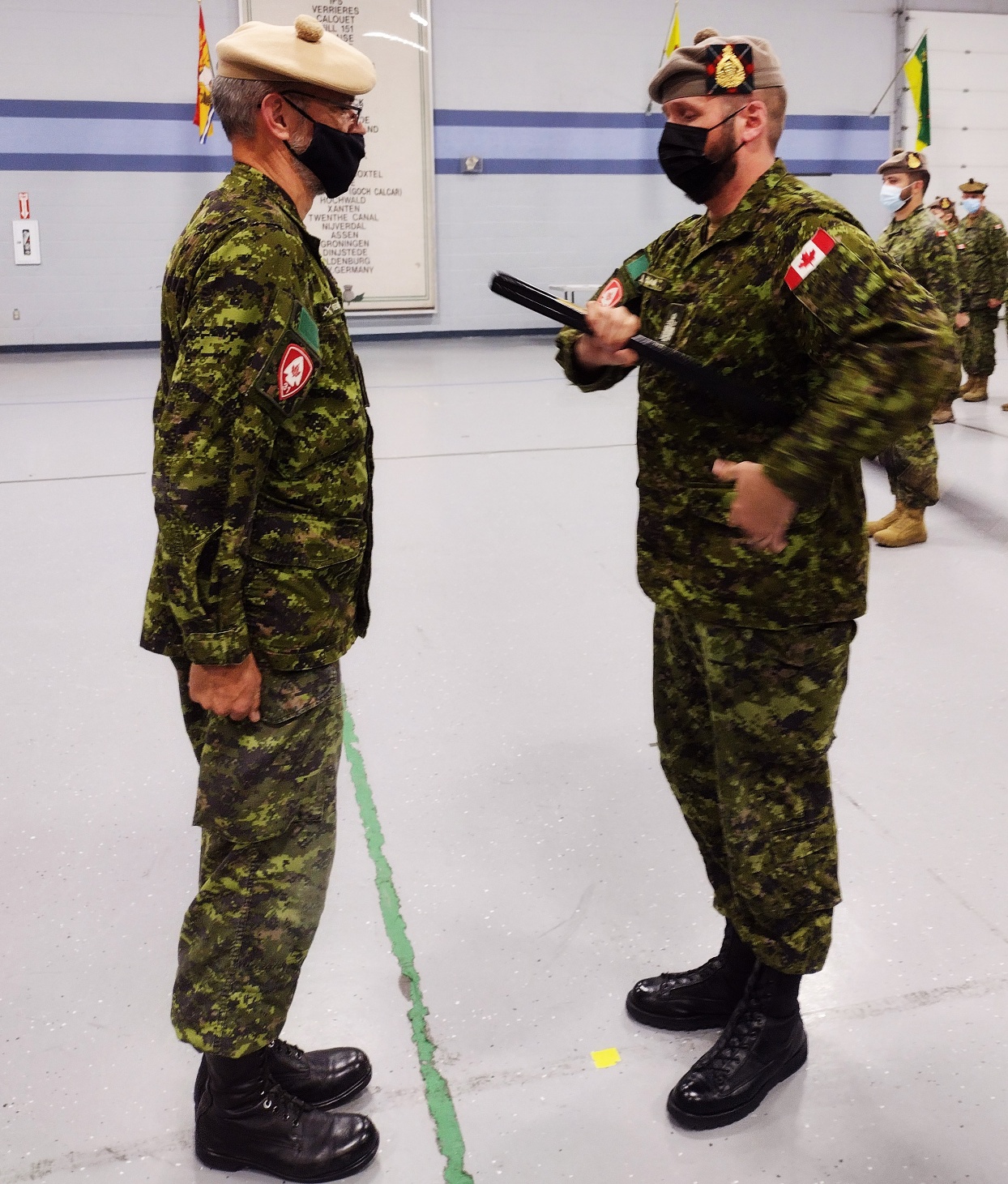 CWO Jeremy Clark receives RSM Pace Stick from CO, LCol Gord Prentice