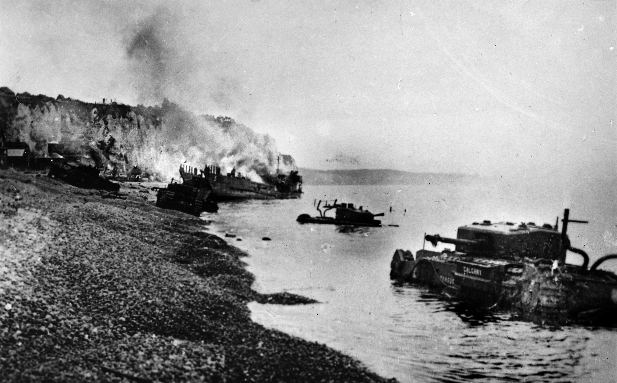 Burning tanks and casualties on Red Beach, Dieppe on August 19, 1942.  Photo courtesy of the family of the late Irvin Snyder.